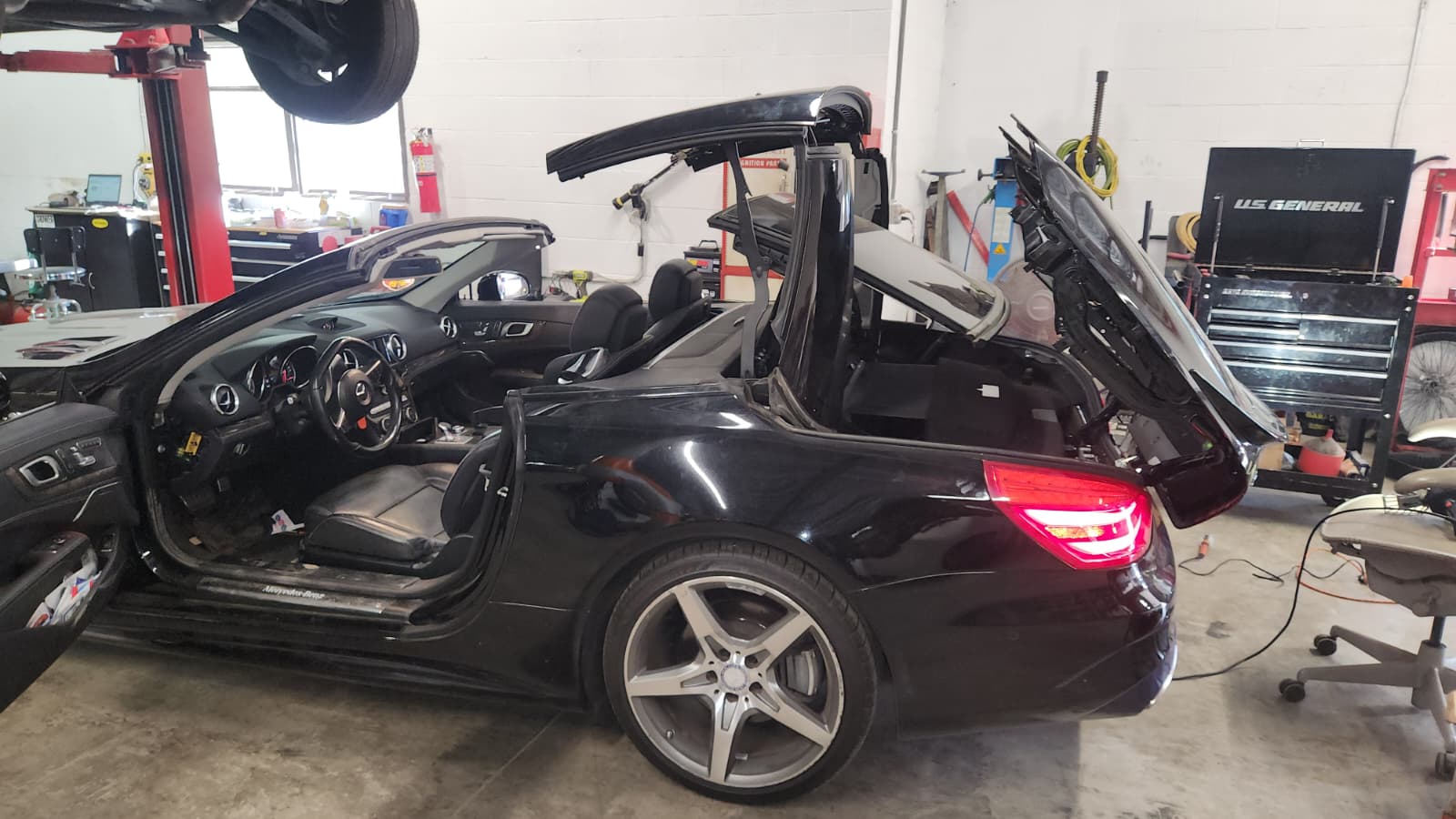 Mercedes coupe with open hood